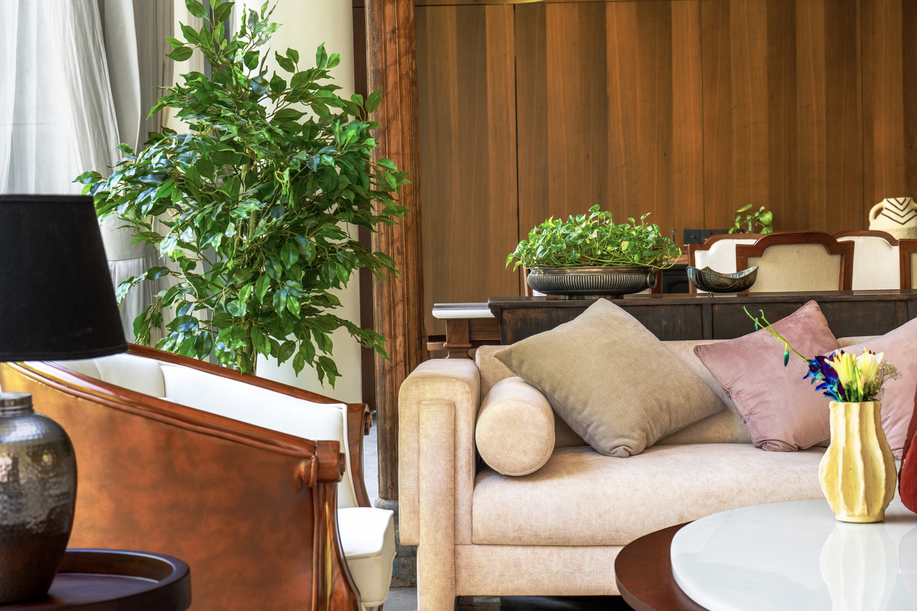 Living lounge with timber-panelled dining beyond, The Holiday Home, Hisar